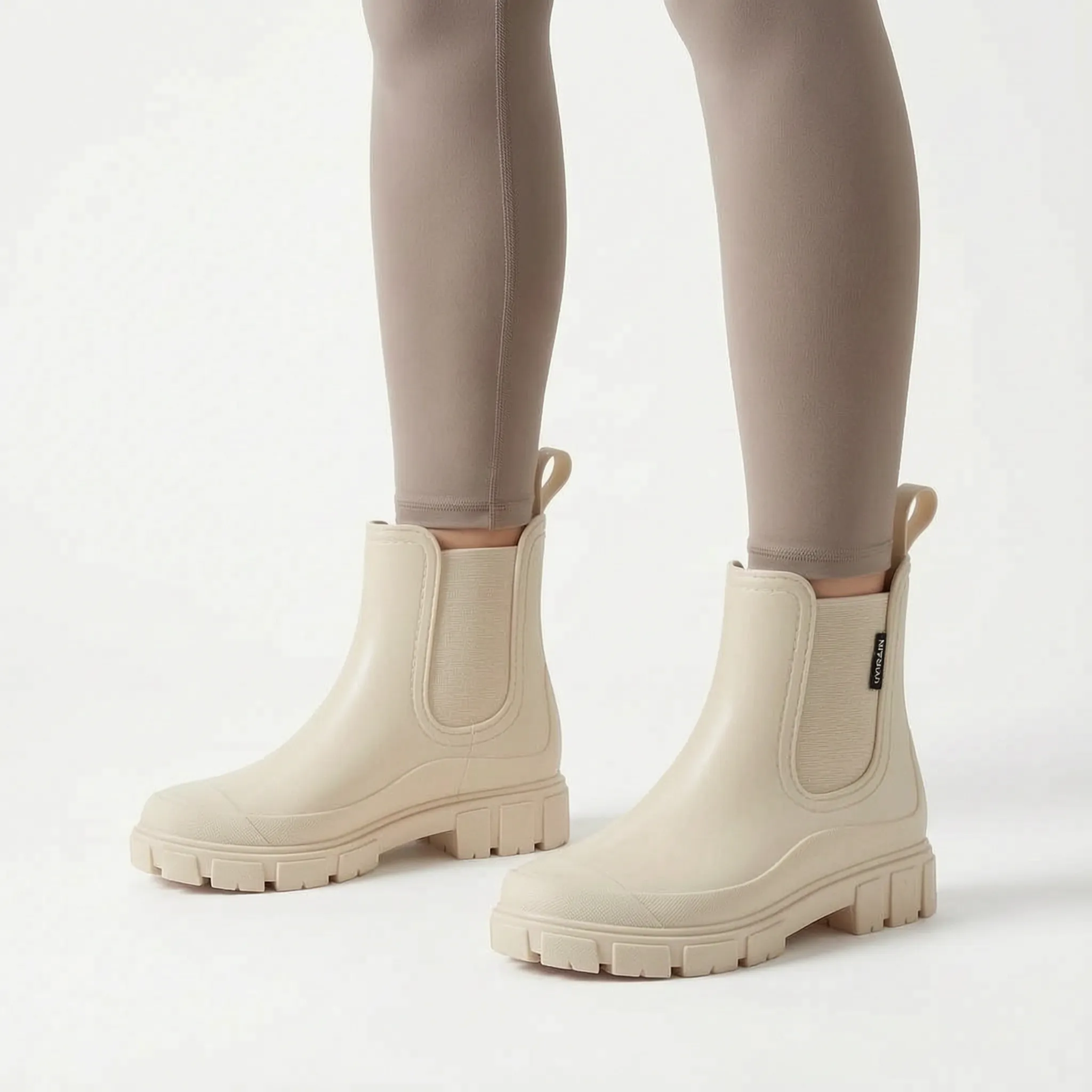 Rainstride  - Chunky Sole Ankle Wellies Navigating Wet Streets