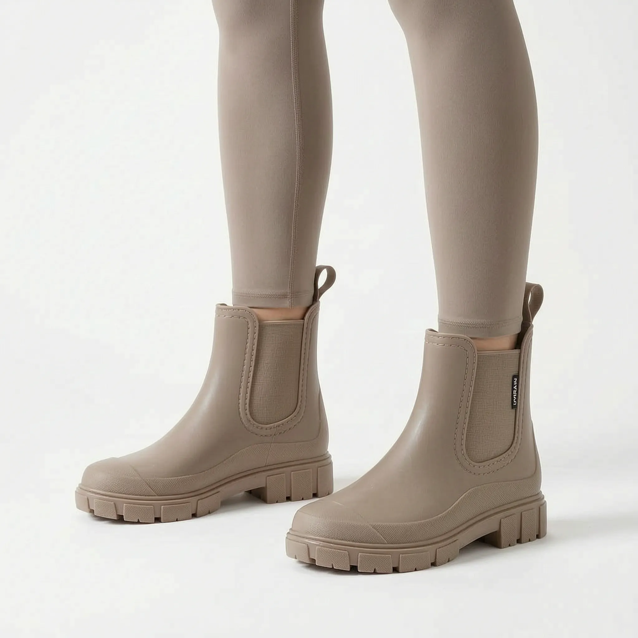Rainstride  - Chunky Sole Ankle Wellies Navigating Wet Streets